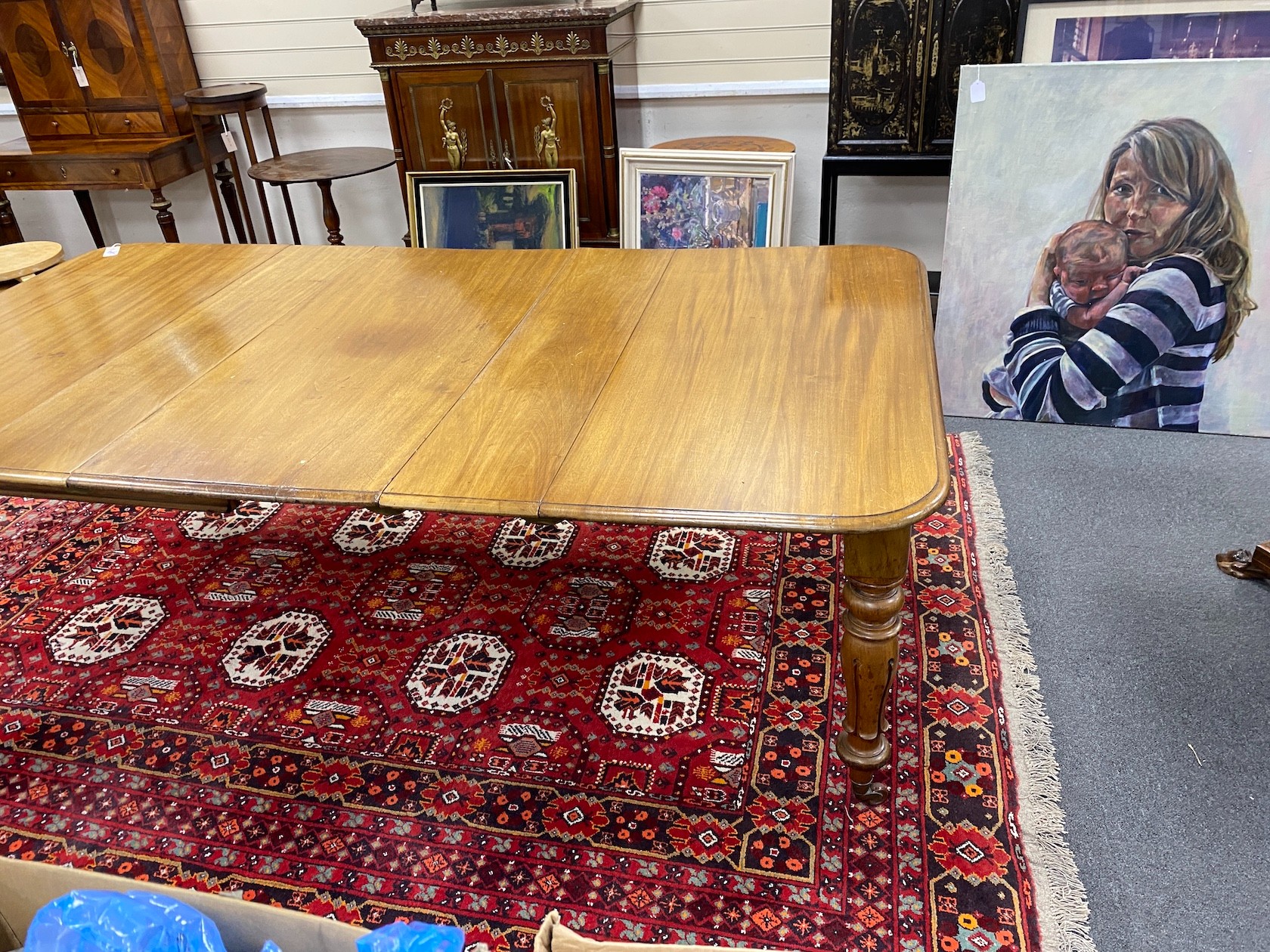 An early Victorian mahogany rectangular extending dining table, length 220cm extended, three spare leaves, width 120cm, height 73cm